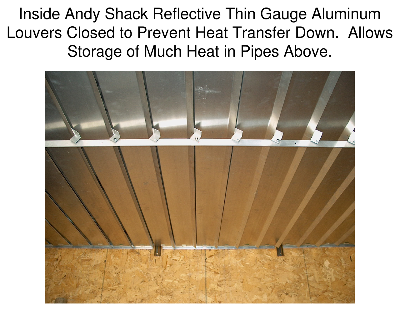 Interior ceiling photograph of the Andy Shack with reflective thin-gauge aluminum louvers closed to prevent heat transfer downward