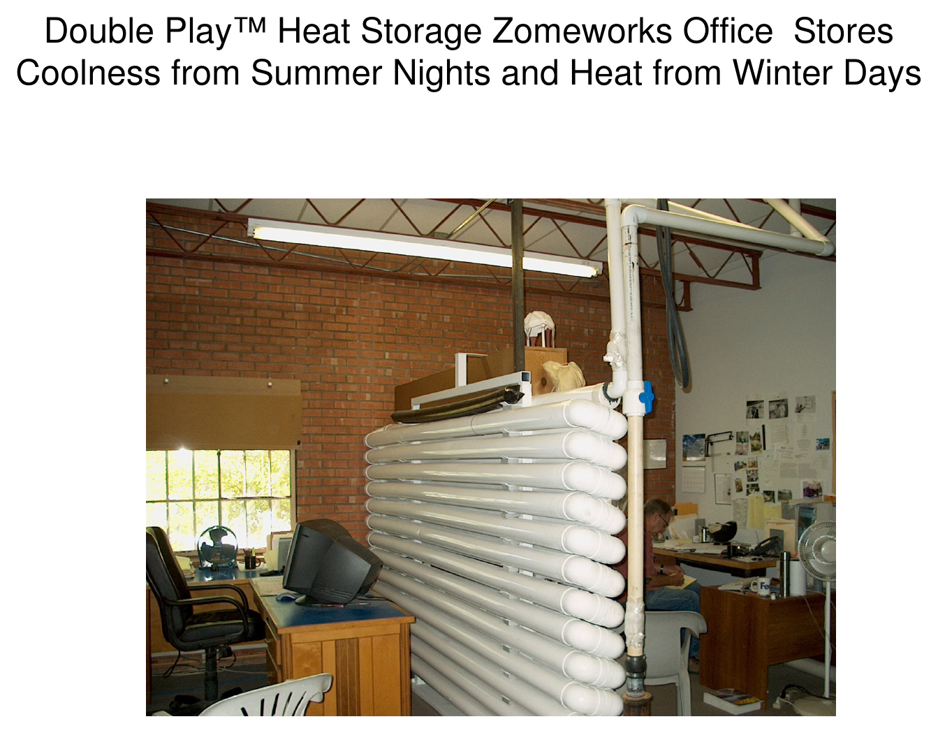 Interior photograph of a cylindrical water storage tank for Double Play heat storage in the Zomeworks office